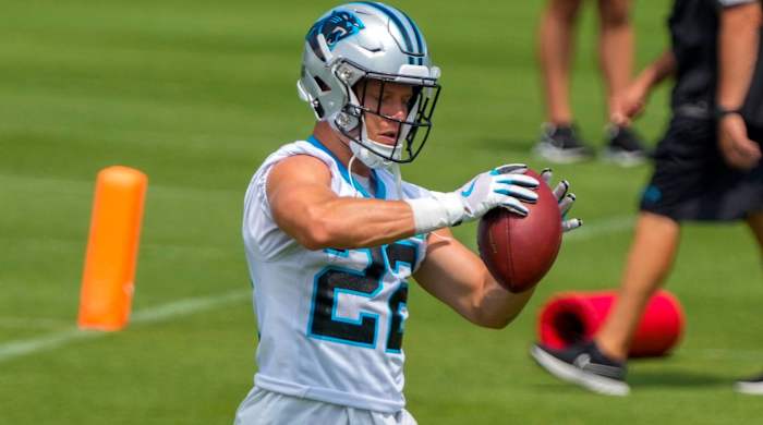 Panthers running back Christian McCaffrey catches a pass in practice during training camp.